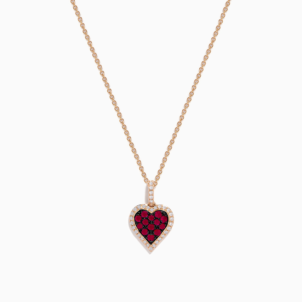 The Ruby Royale 14K Rose Gold Ruby and Diamond Heart Pendant features a ruby heart centerpiece, accented with dazzling diamonds on a rose gold chain.