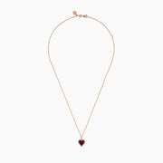 The Ruby Royale 14K Rose Gold Ruby and Diamond Heart Pendant features a ruby heart centerpiece, accented with dazzling diamonds on a rose gold chain.