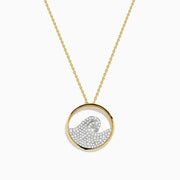 The Seaside 14K White & Yellow Gold Diamond Wave Pendant features a wave design encrusted with sparkling white stones, suspended on a gold chain necklace.