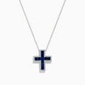 The Royale Bleu 14K White Gold Sapphire and Diamond Cross Pendant features deep blue sapphires and sparkling diamonds, elegantly displayed on a plain white background.