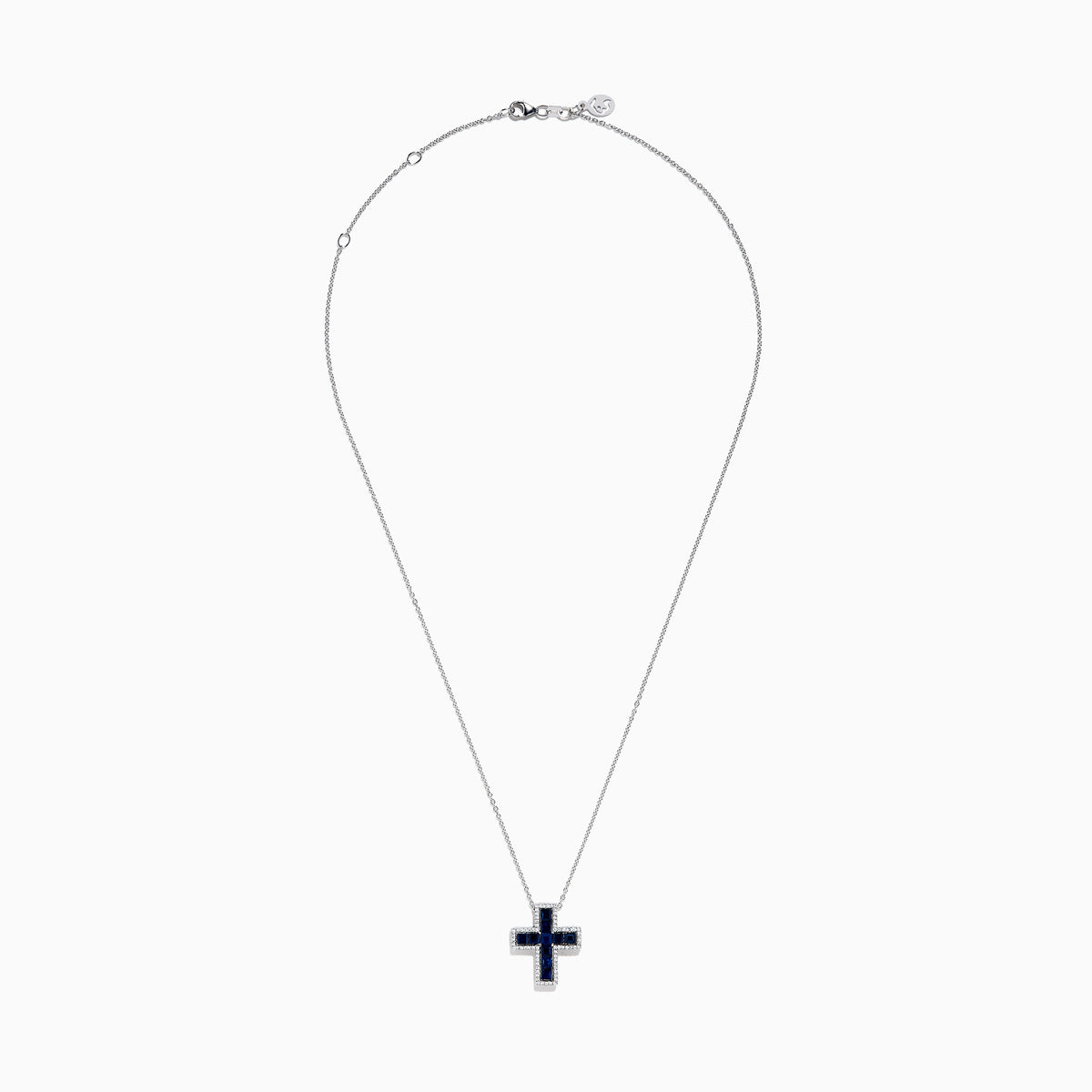The Royale Bleu 14K White Gold Sapphire and Diamond Cross Pendant features deep blue sapphires and sparkling diamonds, elegantly displayed on a plain white background.