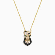 The Signature 14K Yellow Gold White and Black Diamond Panther Pendant features a panther head with white and black diamonds, green accents for the eyes, and a ring in its mouth.