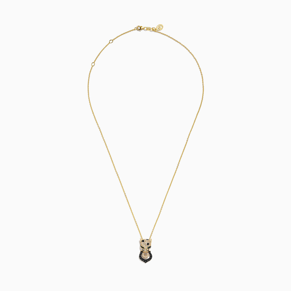 The Signature 14K Yellow Gold White and Black Diamond Panther Pendant features a panther head with white and black diamonds, green accents for the eyes, and a ring in its mouth.