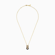 The Signature 14K Yellow Gold White and Black Diamond Panther Pendant features a panther head with white and black diamonds, green accents for the eyes, and a ring in its mouth.