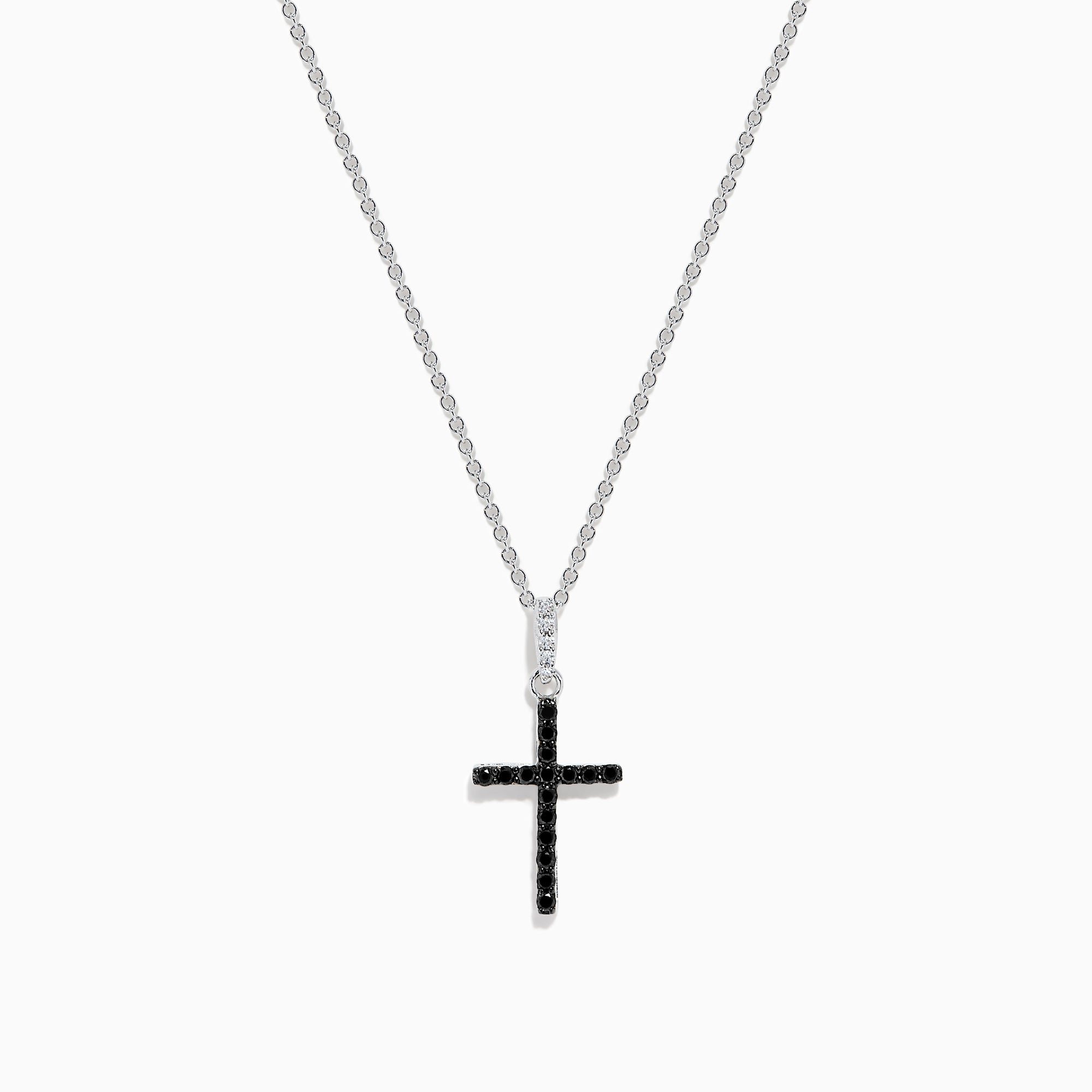 The Novelty 14K White Gold Black and White Diamond Cross Pendant features black stones and a single clear stone at the top, shown on a silver chain against a plain white background.