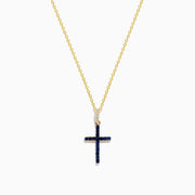 The Novelty 14K Yellow Gold Sapphire and Diamond Cross Pendant features a cross adorned with sapphires and sparkling diamonds, shown on a plain white background.