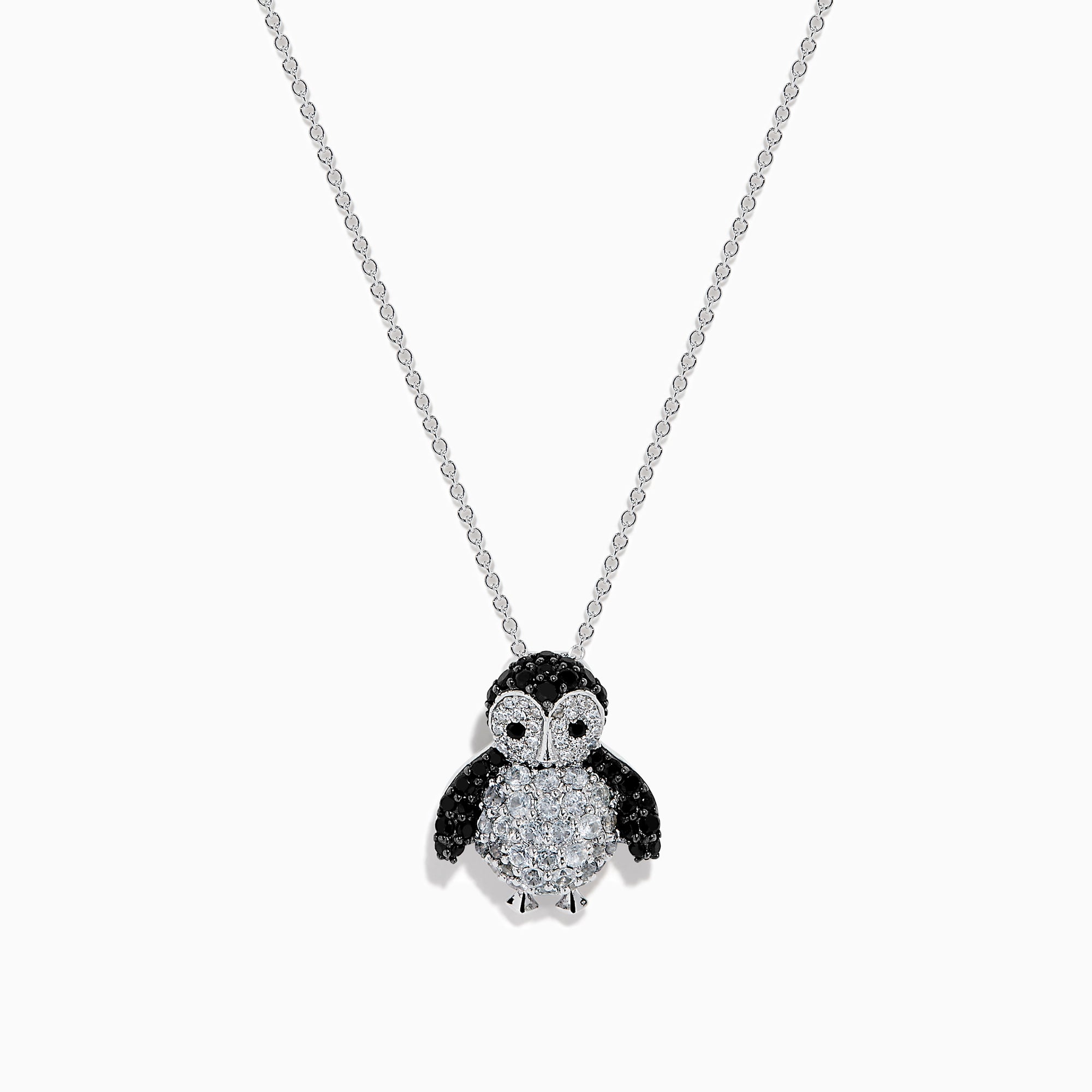 A 14K white gold necklace featuring a penguin pendant accented with diamonds, white sapphires, and black spinel.