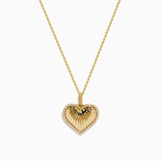 The Novelty 14K Yellow Gold Diamond Heart Pendant features a sunburst diamond design with a sparkling border, shown on a plain white background. A unique addition to any jewelry collection.