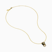 The Signature 14K Yellow Gold Diamond and Rhodium Panther Pendant features black and green details and a circular gold ring in the panther’s mouth.