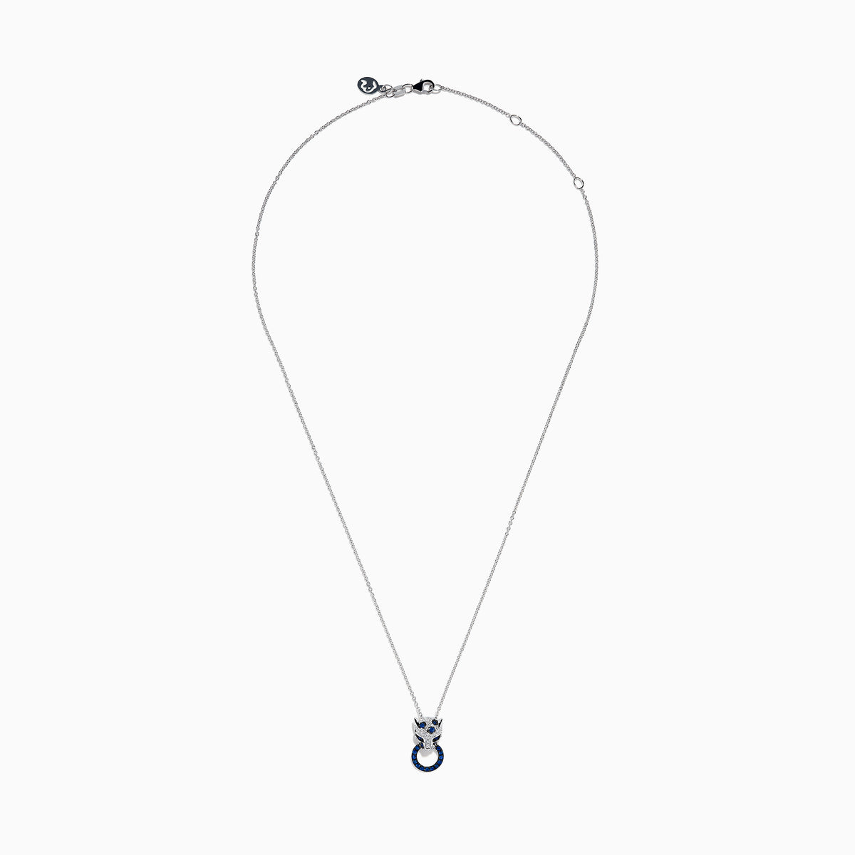 The Signature 14K White Gold Blue Sapphire and Diamond Panther Pendant showcases a diamond-studded panther head with blue and white gemstones, gripping a vivid blue sapphire pendant ring in its mouth.