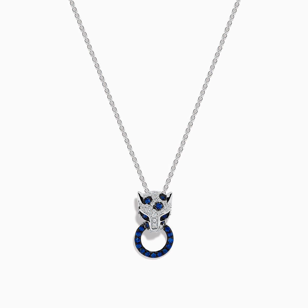 The Signature 14K White Gold Blue Sapphire and Diamond Panther Pendant showcases a diamond-studded panther head with blue and white gemstones, gripping a vivid blue sapphire pendant ring in its mouth.