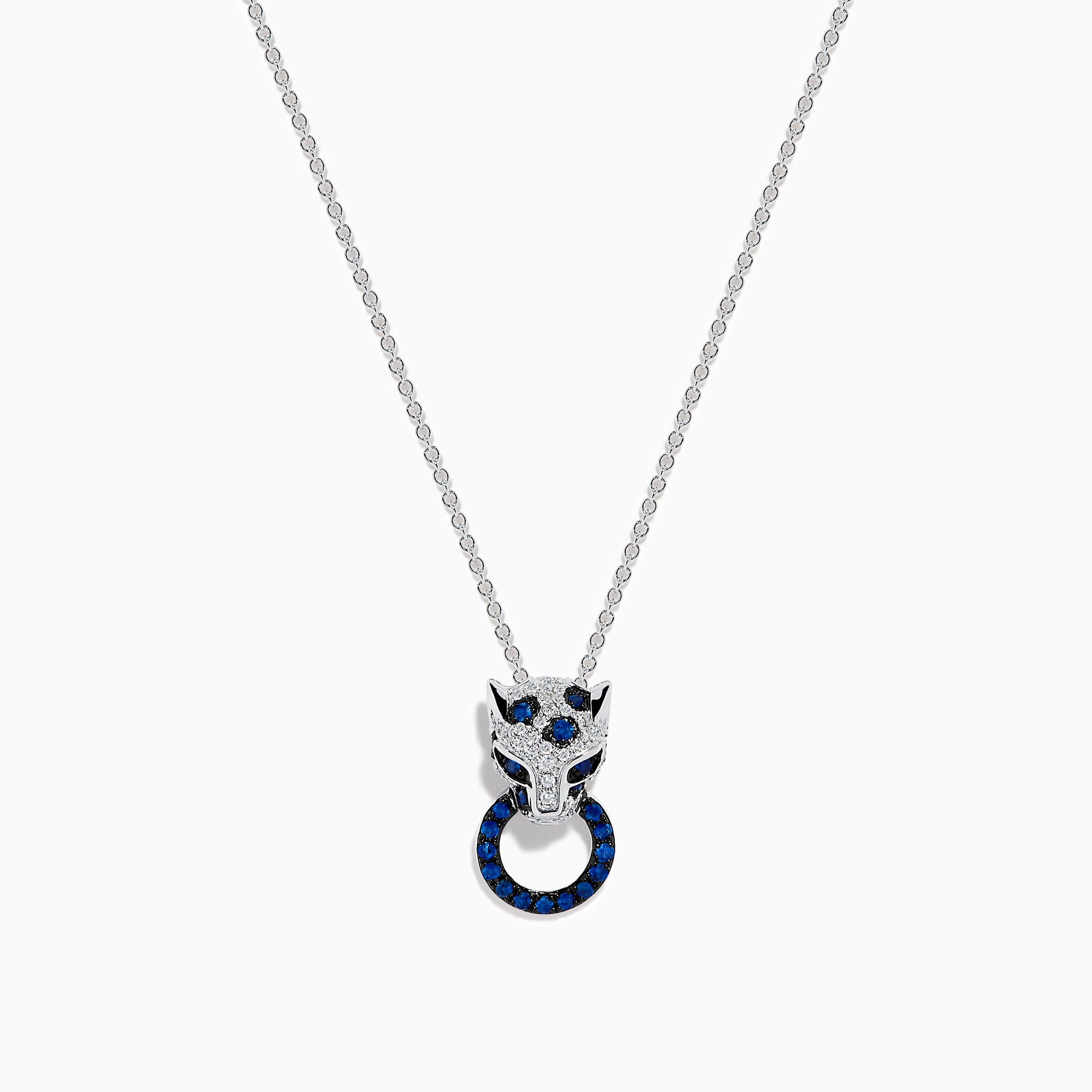 The Signature 14K White Gold Blue Sapphire and Diamond Panther Pendant showcases a diamond-studded panther head with blue and white gemstones, gripping a vivid blue sapphire pendant ring in its mouth.