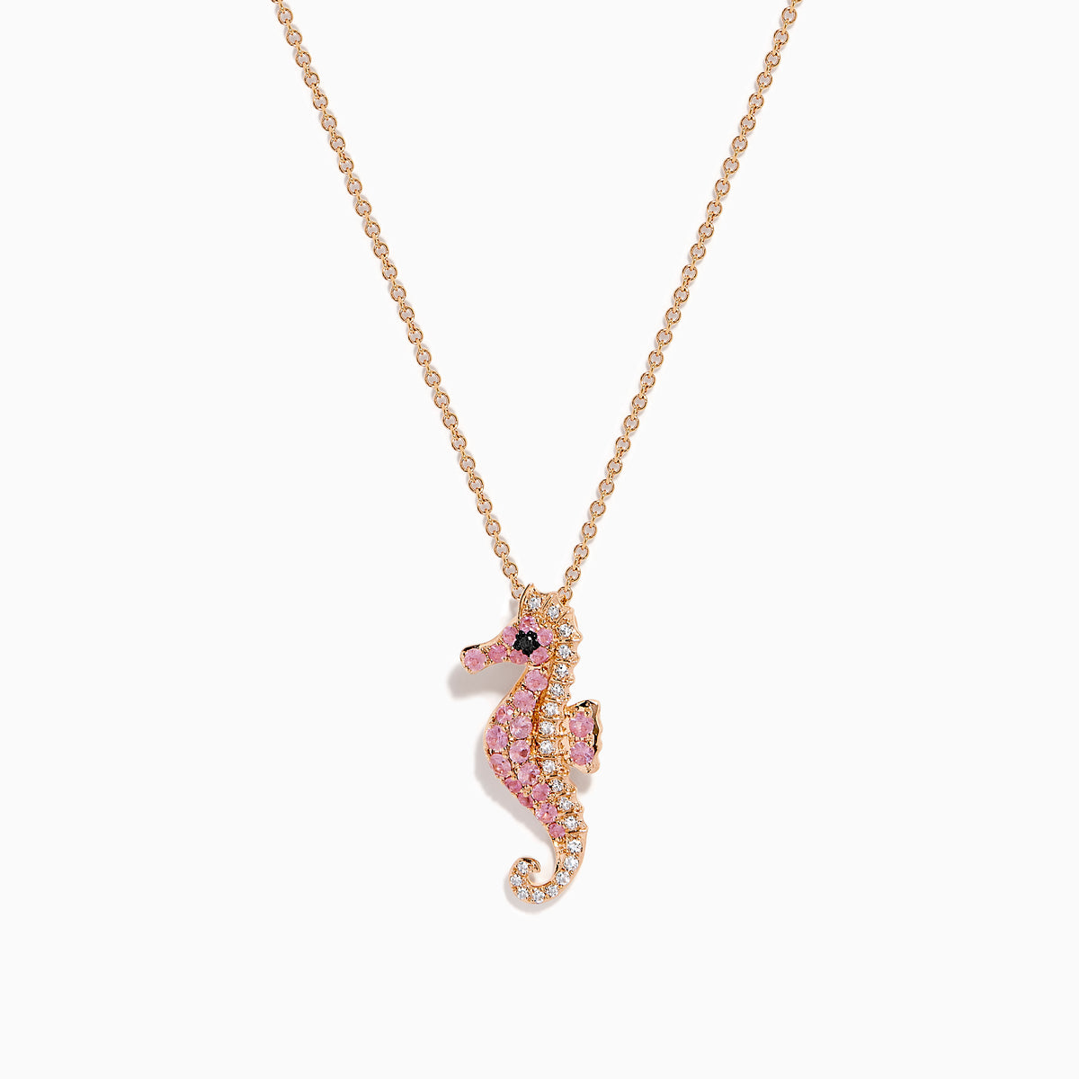 The 14K Rose Gold Pink Sapphire and Diamond Pave Seahorse Pendant features pink sapphires, diamond accents, and a small black gemstone eye, all set in rose gold and displayed against a white background.