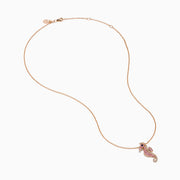 The 14K Rose Gold Pink Sapphire and Diamond Pave Seahorse Pendant features pink sapphires, diamond accents, and a small black gemstone eye, all set in rose gold and displayed against a white background.