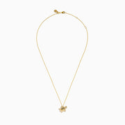 The 14K Yellow Gold Diamond Fluted Shell Turtle Pendant features a turtle-shaped design with fluted shell detailing and sparkling diamond accents, shown against a white background.