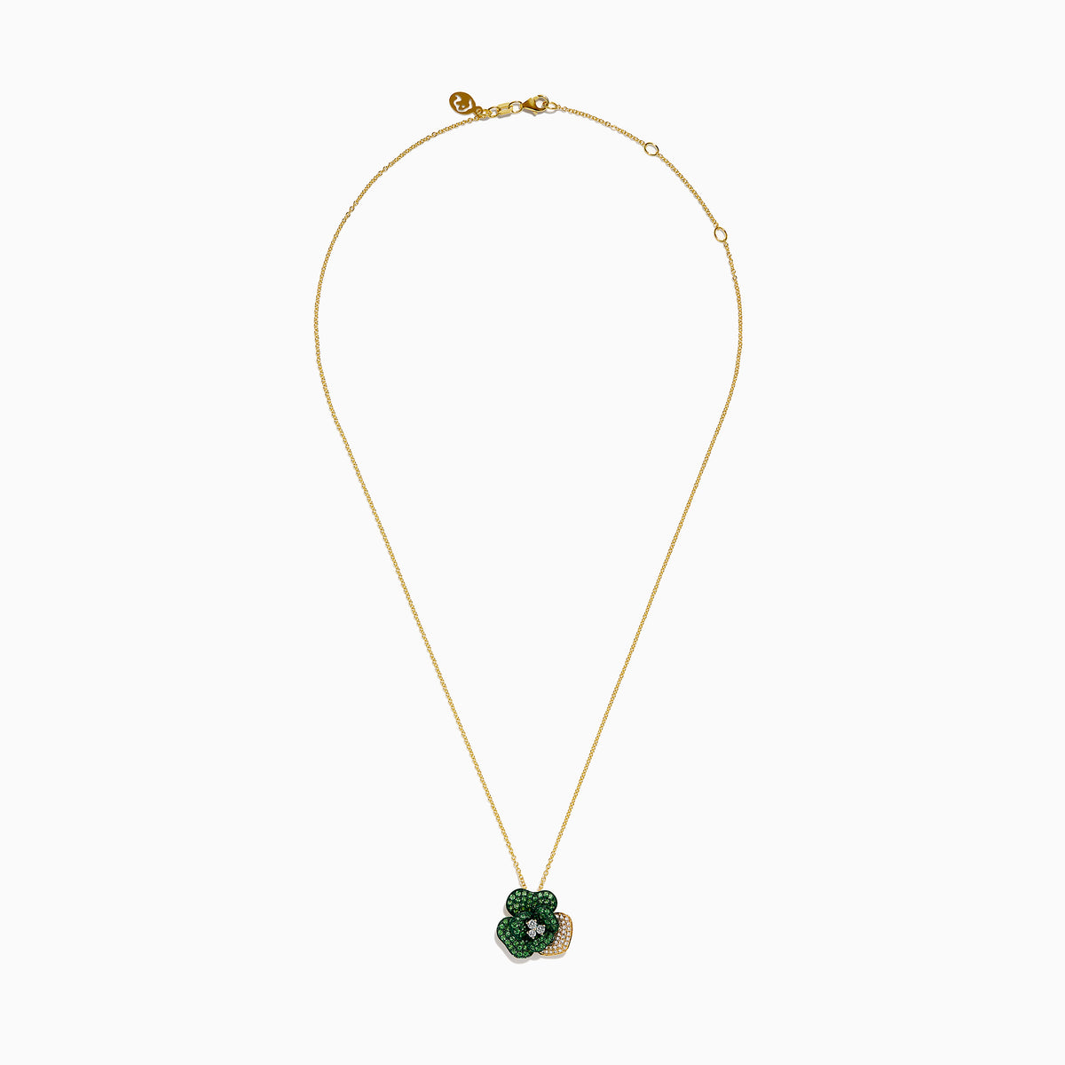 The 14K Yellow Gold Tsavorite and Diamond Flower Pendant features a floral design with one petal set with diamonds and the others adorned with vibrant green tsavorites.