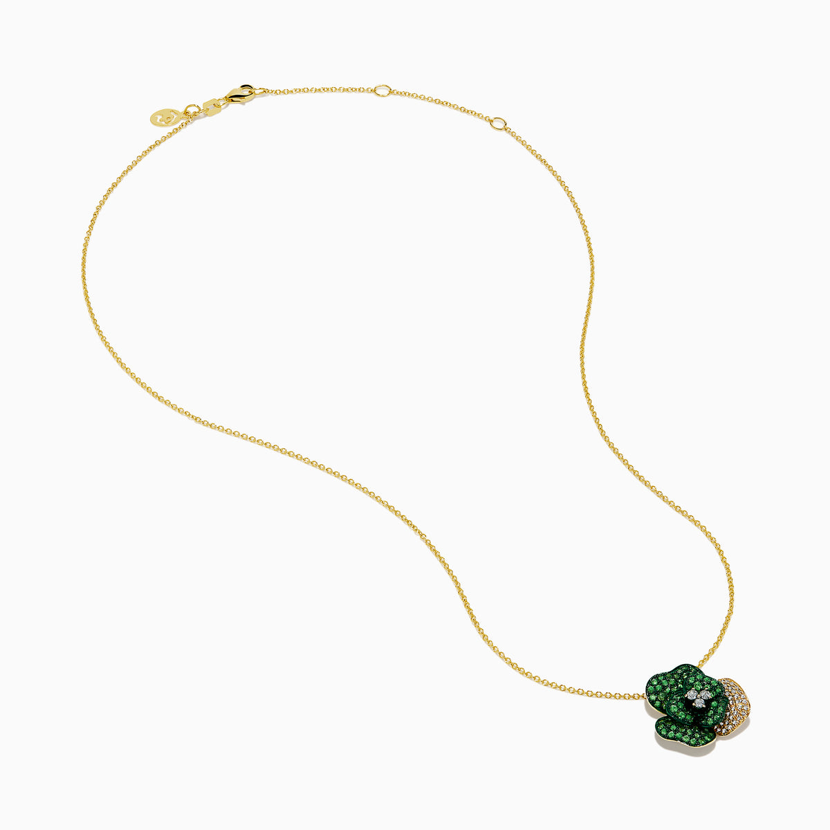 The 14K Yellow Gold Tsavorite and Diamond Flower Pendant features a floral design with one petal set with diamonds and the others adorned with vibrant green tsavorites.