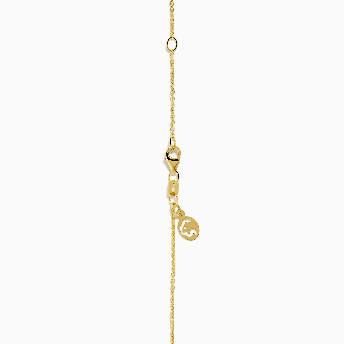 The Signature 14K Yellow Gold Diamond and Tsavorite Panther Pendant showcases a panther’s head with tsavorite eyes, diamond accents, and a diamond-studded ring in its mouth.