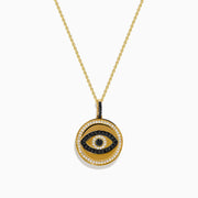 The Novelty 14K Yellow Gold Black and White Diamond Evil Eye Pendant features a round charm with black and white diamonds forming an eye, accented by a border of small clear stones.