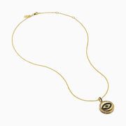 The Novelty 14K Yellow Gold Black and White Diamond Evil Eye Pendant features a round charm with black and white diamonds forming an eye, accented by a border of small clear stones.