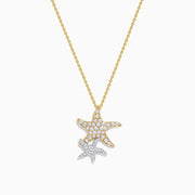 The 14K Two-Tone Gold Diamond Double Starfish Duo Pendant features a gold starfish with sparkling diamonds alongside a silver diamond starfish, creating an elegant, layered necklace look.