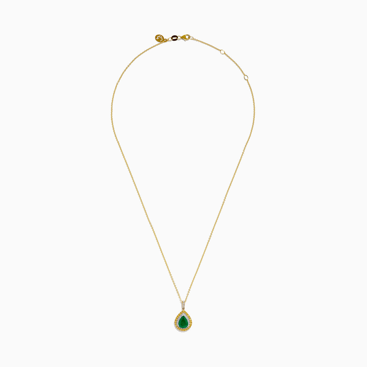 The 14K Two Tone Emerald Double Halo Pendant features a teardrop-shaped emerald accented by yellow and white diamonds on a gold chain.