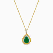 The 14K Two Tone Emerald Double Halo Pendant features a teardrop-shaped emerald accented by yellow and white diamonds on a gold chain.