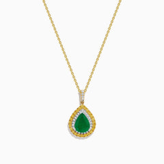 The 14K Two Tone Emerald Double Halo Pendant features a teardrop-shaped emerald accented by yellow and white diamonds on a gold chain.