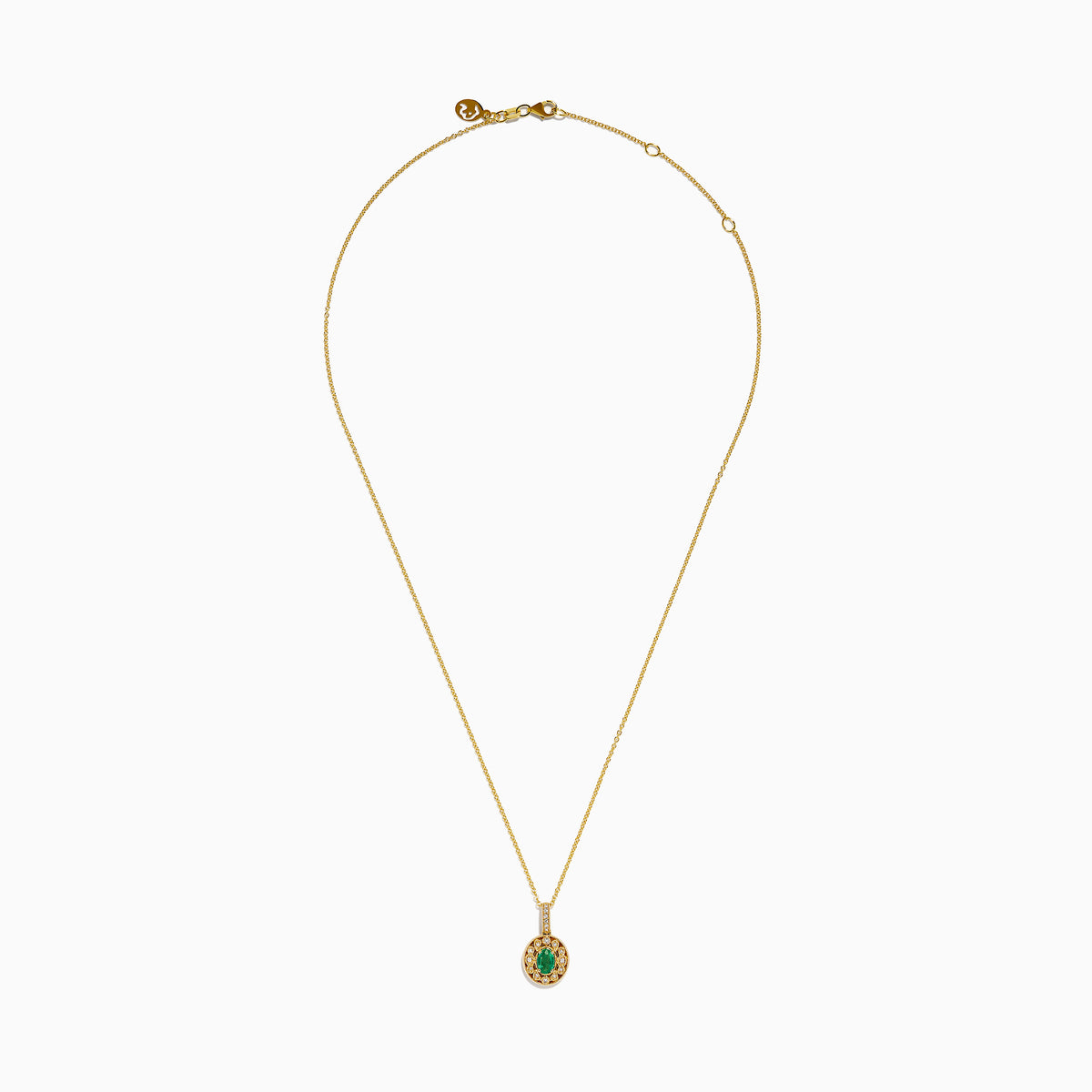 The 14K Yellow Gold Emerald and Diamond Filigree Halo Pendant features an elegant oval green emerald encircled by sparkling diamonds, with additional diamond accents on the bail for added brilliance.