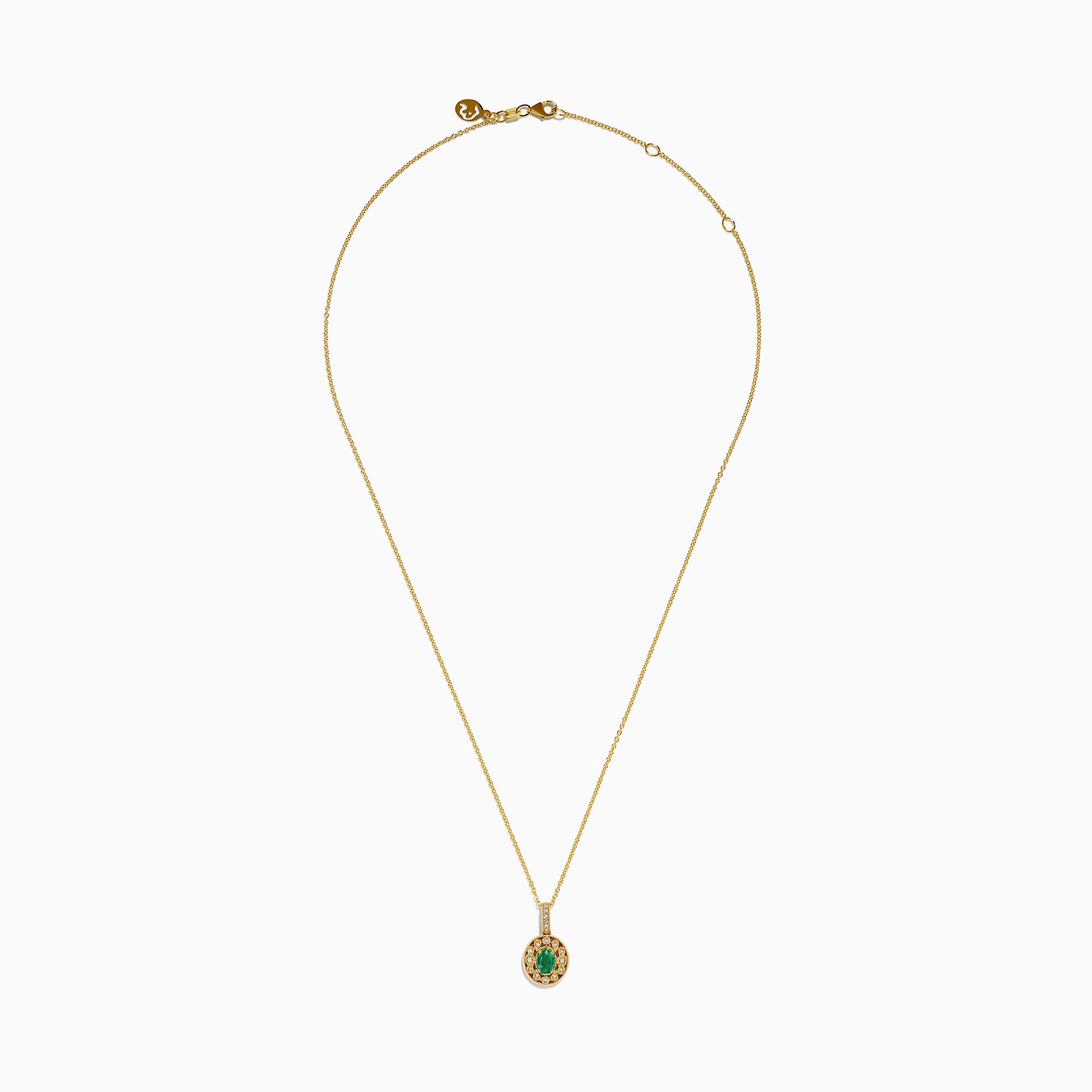 The 14K Yellow Gold Emerald and Diamond Filigree Halo Pendant features an elegant oval green emerald encircled by sparkling diamonds, with additional diamond accents on the bail for added brilliance.