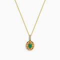 The 14K Yellow Gold Emerald and Diamond Filigree Halo Pendant features an elegant oval green emerald encircled by sparkling diamonds, with additional diamond accents on the bail for added brilliance.