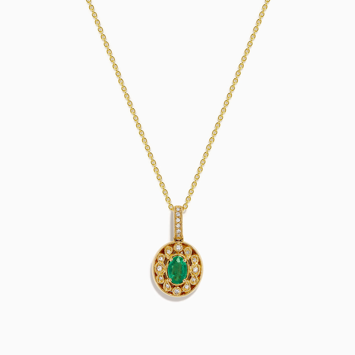 The 14K Yellow Gold Emerald and Diamond Filigree Halo Pendant features an elegant oval green emerald encircled by sparkling diamonds, with additional diamond accents on the bail for added brilliance.