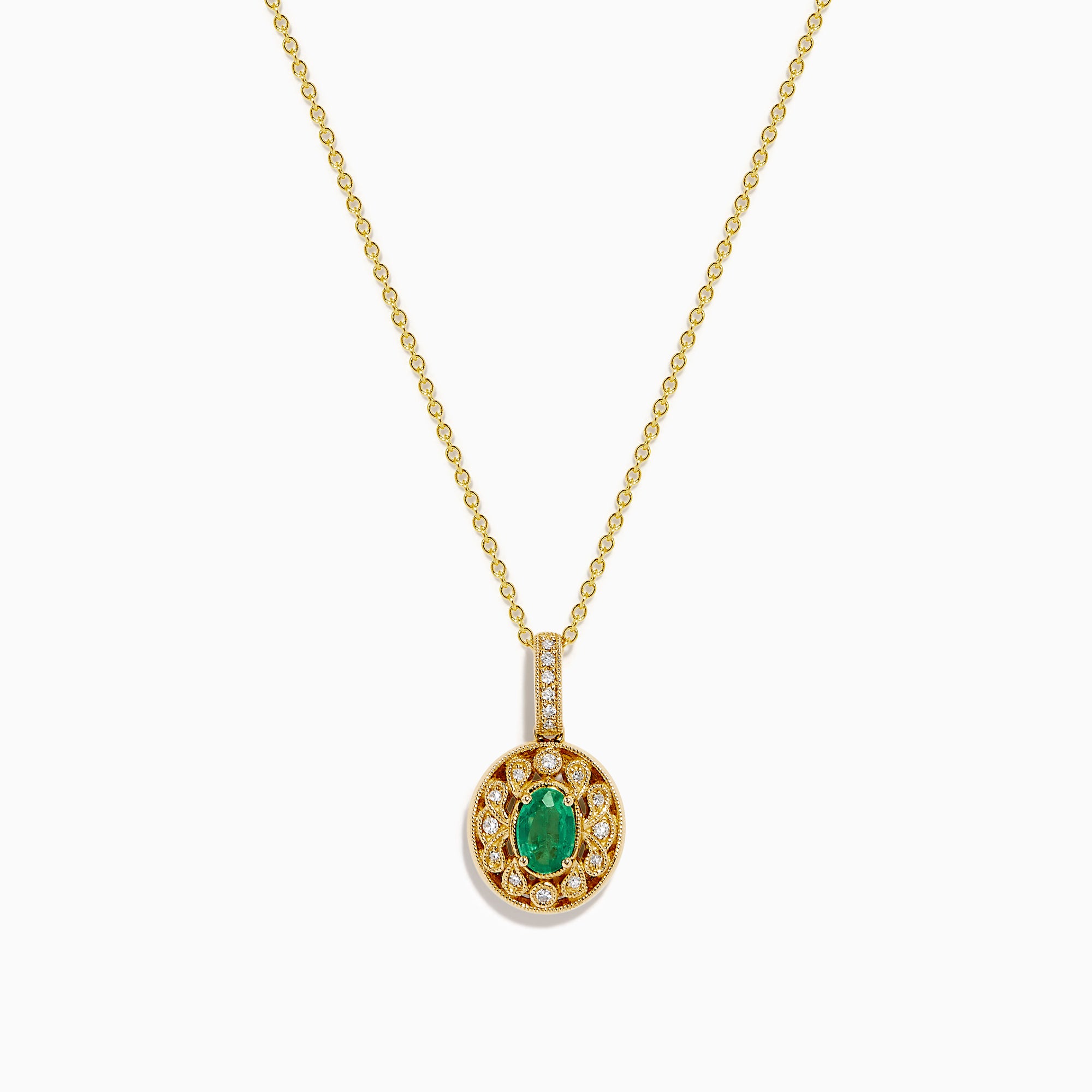 The 14K Yellow Gold Emerald and Diamond Filigree Halo Pendant features an elegant oval green emerald encircled by sparkling diamonds, with additional diamond accents on the bail for added brilliance.