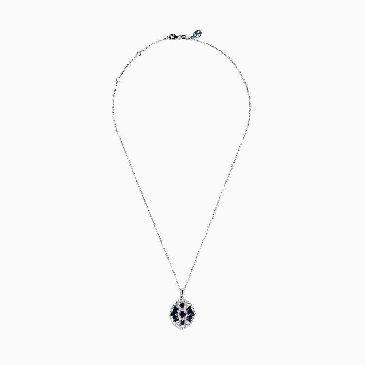 The 14K White Gold Sapphire and Diamond Vintage Pendant features deep blue sapphires and sparkling diamonds in a geometric design, suspended from a delicate white gold chain, all displayed on a white background.