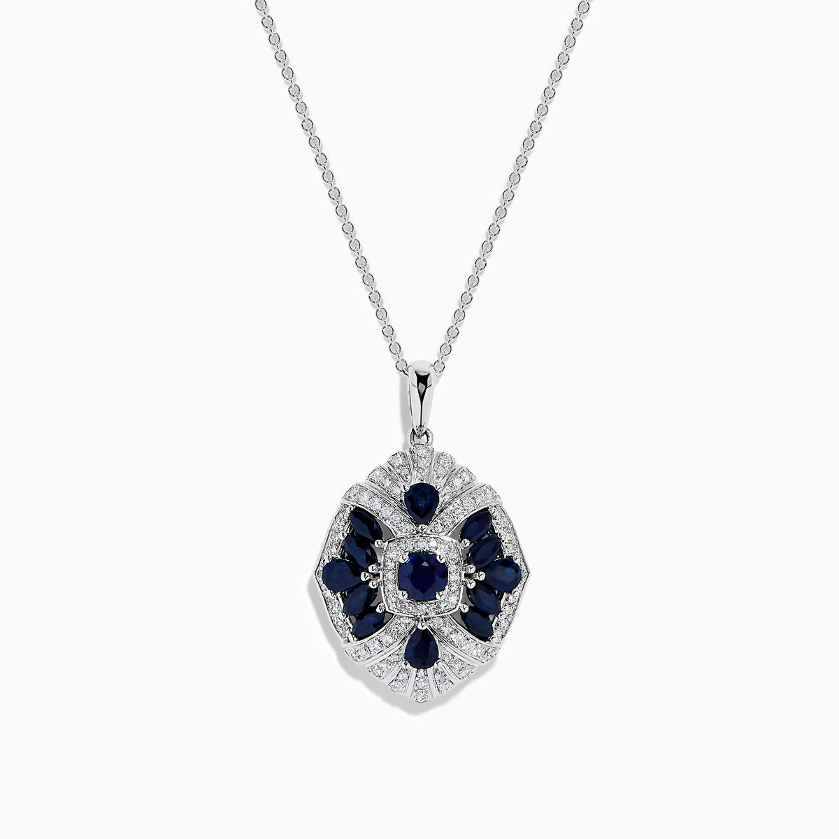 The 14K White Gold Sapphire and Diamond Vintage Pendant features deep blue sapphires and sparkling diamonds in a geometric design, suspended from a delicate white gold chain, all displayed on a white background.