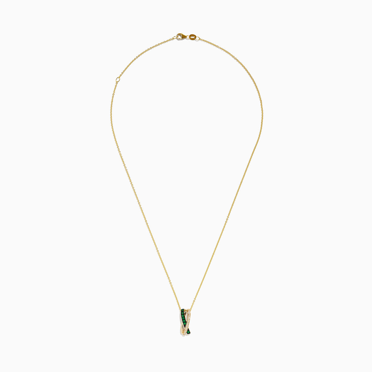 The 14K Yellow Gold Emerald and Diamond Crossover Pendant features interwoven bands—one set with emeralds, the other with sparkling diamonds—on a delicate gold chain for an elegant effect.