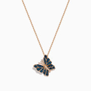 The Bella Bleu 14K Rose Gold White and Blue Diamond Butterfly Pendant necklace features a butterfly pendant with white and blue diamonds and small clear crystals, shown on a white background.