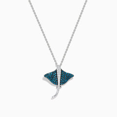 The Seaside Bella Bleu 14K White Gold Blue and White Diamond Sting Ray Pendant features sparkling blue and white diamonds on a delicate chain, displayed against a white background.