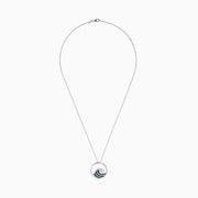 The Seaside 14K White Gold Blue and White Diamond Wave Pendant features a circular design with sparkling gems on a delicate chain, offering an elegant and airy style.