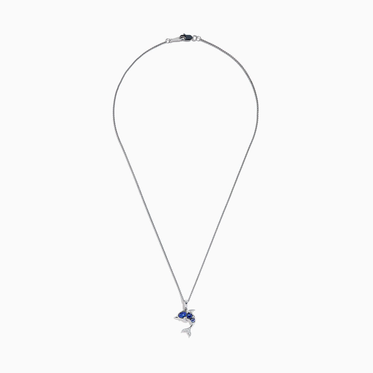The 925 Silver Tanzanite and Diamond Dolphin Pendant features tanzanite-blue gems on the body and sparkling diamonds on the tail, elegantly showcased against a white background.