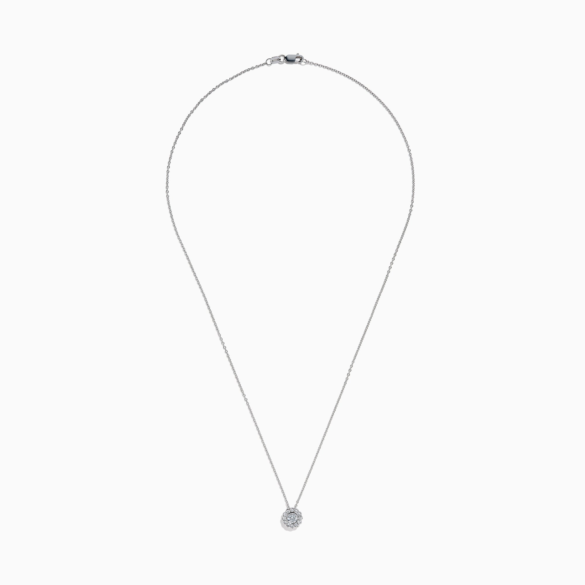 The 14K White Gold Diamond Bezel Halo Pendant features a delicate white gold chain with a round, flower-like diamond pendant, showcasing a central diamond surrounded by a halo of smaller diamonds.