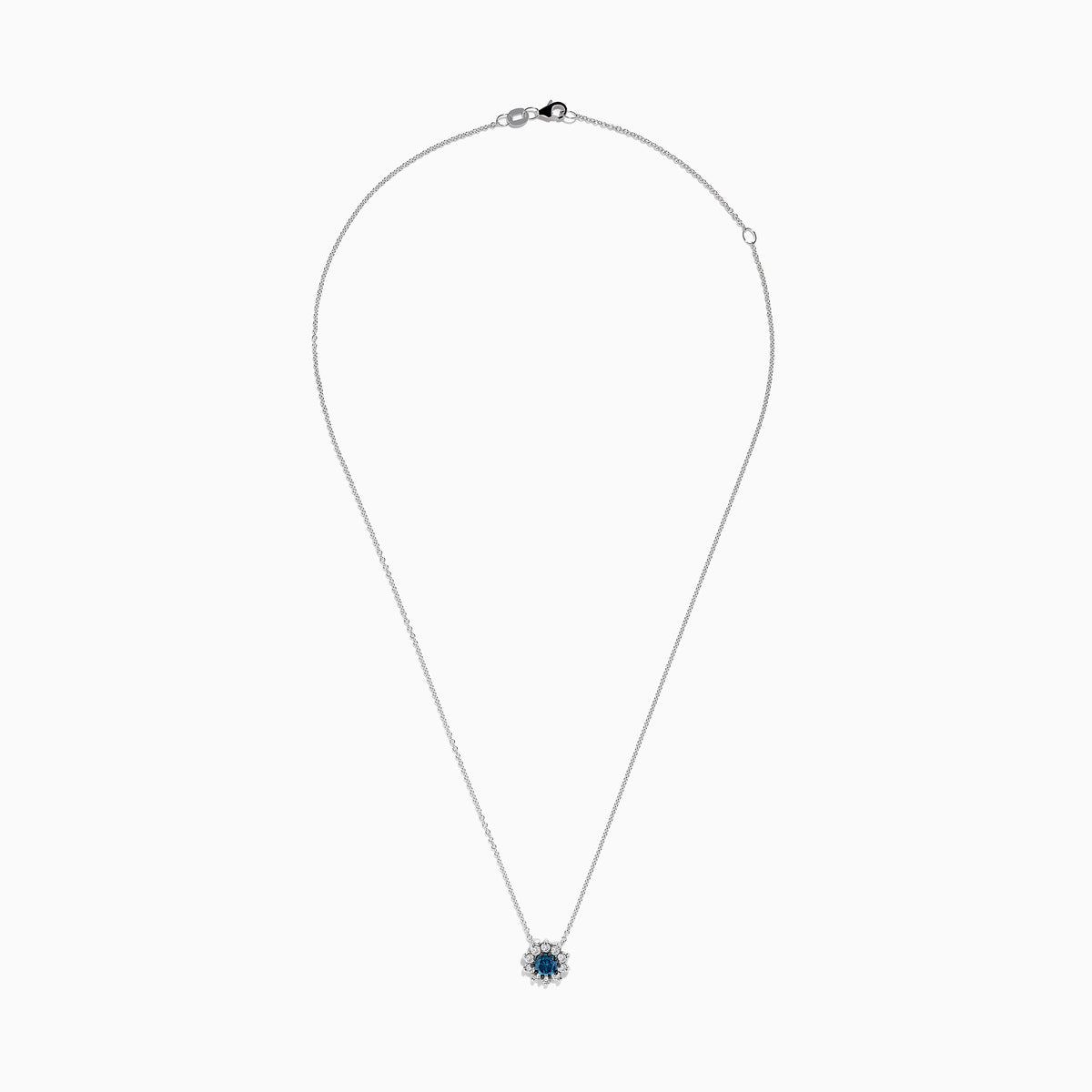 The Bella Bleu 14K White Gold Blue and White Diamond Pendant (1.60 TCW) features a flower-shaped design with a central blue stone and sparkling white diamonds, suspended on a fine chain against a plain white background.