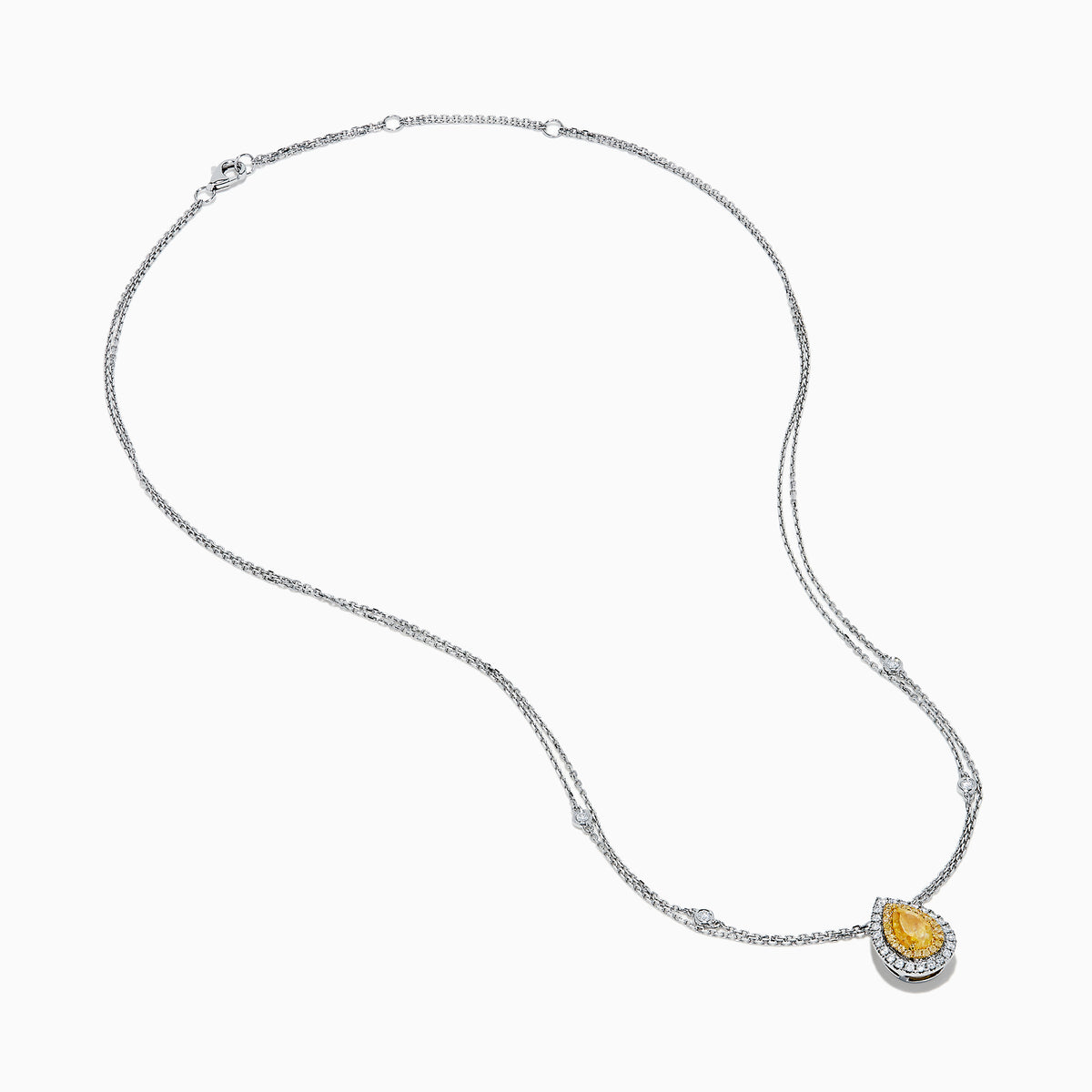 The 18K Two Toned White & Yellow Diamond Layered Doble Halo Pendant features a double-strand silver necklace with a pear-shaped yellow gemstone, diamond halos, and additional round diamonds on layered chains.