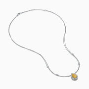 The 18K Two Toned White & Yellow Diamond Layered Doble Halo Pendant features a double-strand silver necklace with a pear-shaped yellow gemstone, diamond halos, and additional round diamonds on layered chains.