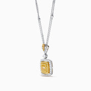 The Canare 18K Two Tone Gold Pendant features a double chain and a square pendant with yellow diamonds in the center, clear stones around, plus extra stones on the chain and bail.