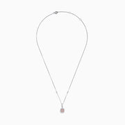An 18K Two Tone Gold White and Pink Diamond Pendant featuring a square white diamond with a pink center stone, accented by two halos of sparkling white diamonds on a silver chain set with small diamonds.