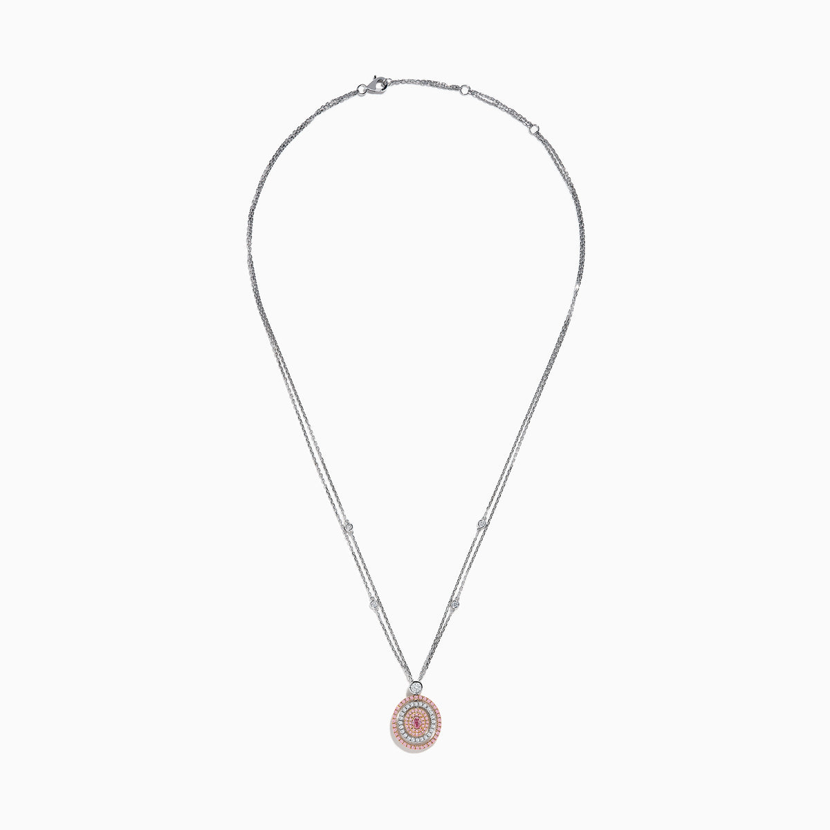 The 18K Two Tone Gold White and Pink Diamond Pendant necklace features a double-chain design with a round pendant of concentric circles, set with white and pink diamonds and topped by a single white gemstone.
