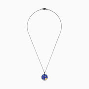The Nahla 925 Silver and 18K Yellow Gold Tanzanite and Diamond Seashell Pendant features clustered tanzanite gems in a round design, accented with a small diamond 18K yellow gold seashell at the bottom right.