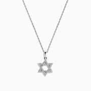 The 925 Sterling Silver Diamond Star of David Pendant is showcased on a silver chain, elegantly displayed against a white background.