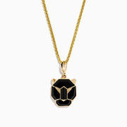 The Mens 14K Yellow Gold Onyx Panther Pendant features a geometric black and gold design, elegantly displayed on a yellow gold chain against a white background.
